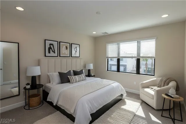 a bedroom with bed and window