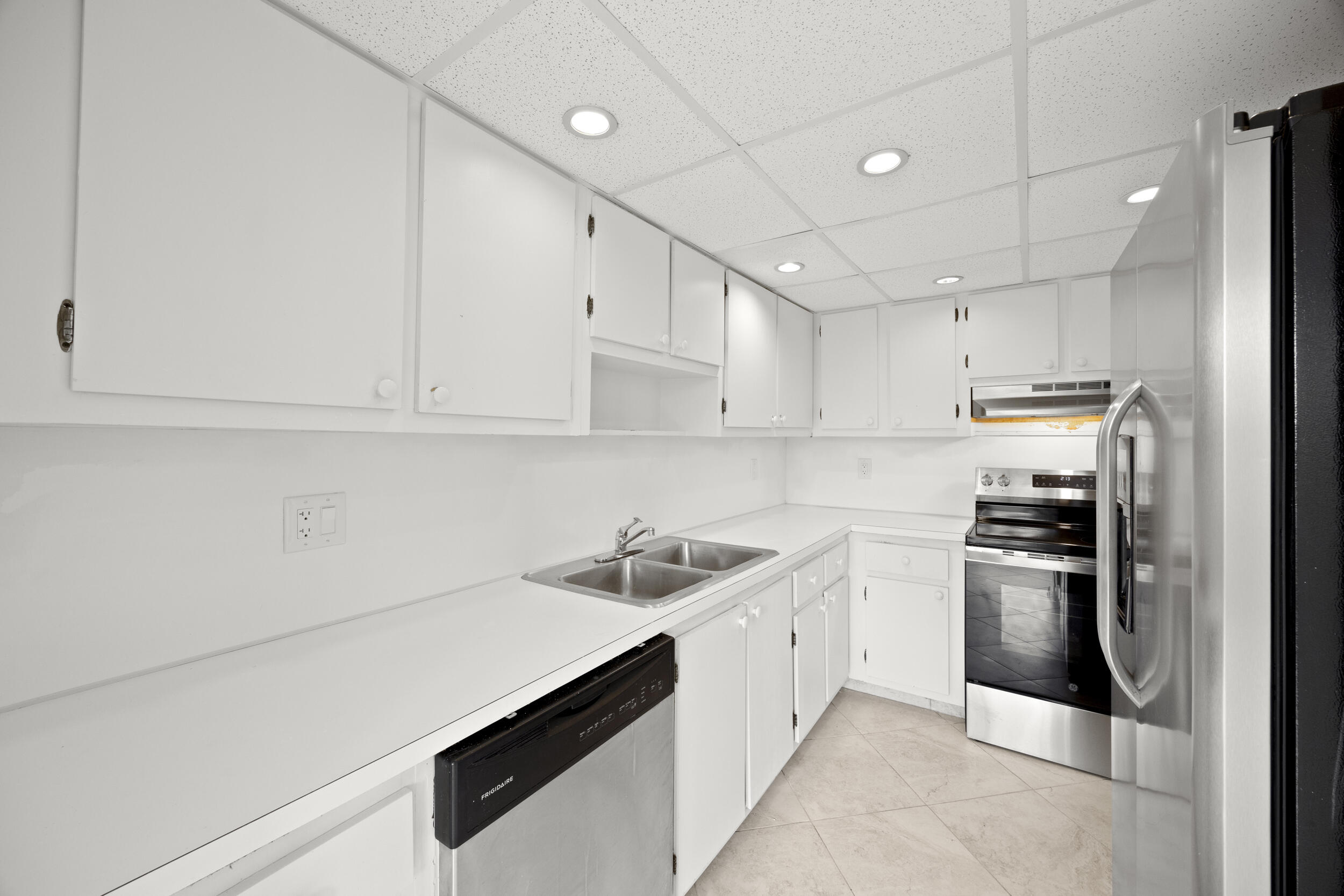 1401 South Federal Highway, Unit 220 Boca Raton, FL 33432 - Photo 13 of 27 a kitchen that has a sink and stainless steel appliances