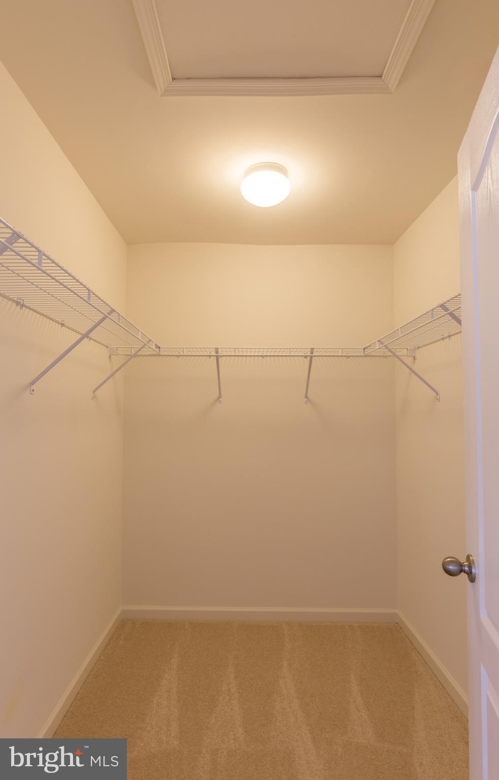 902 Ramble Run Road Middle River, MD 21220 - Photo 22 of 30 a view of a room with racks on the wall