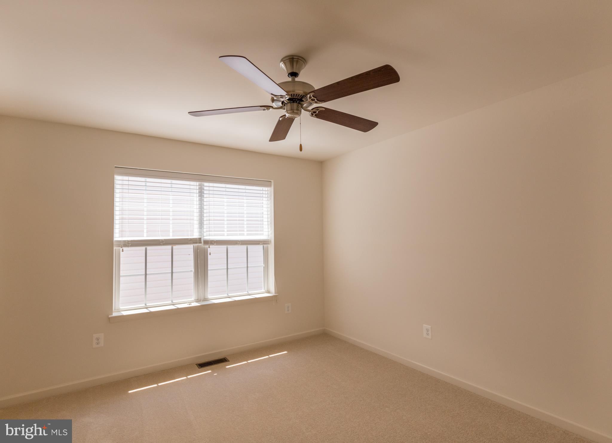 902 Ramble Run Road Middle River, MD 21220 - Photo 26 of 30 an empty room with a window and a fan