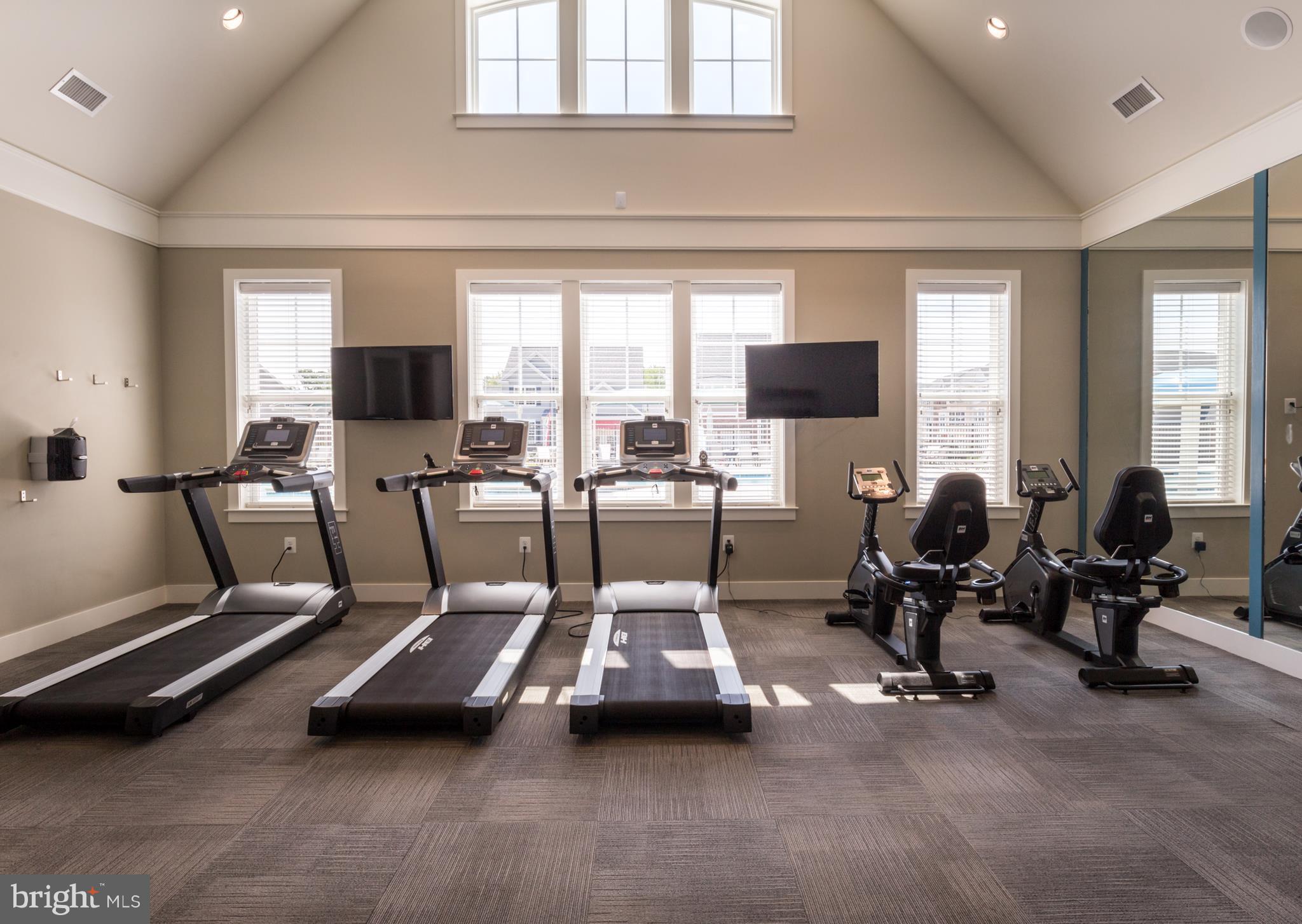 902 Ramble Run Road Middle River, MD 21220 - Photo 9 of 30 a room with gym equipment and a large window