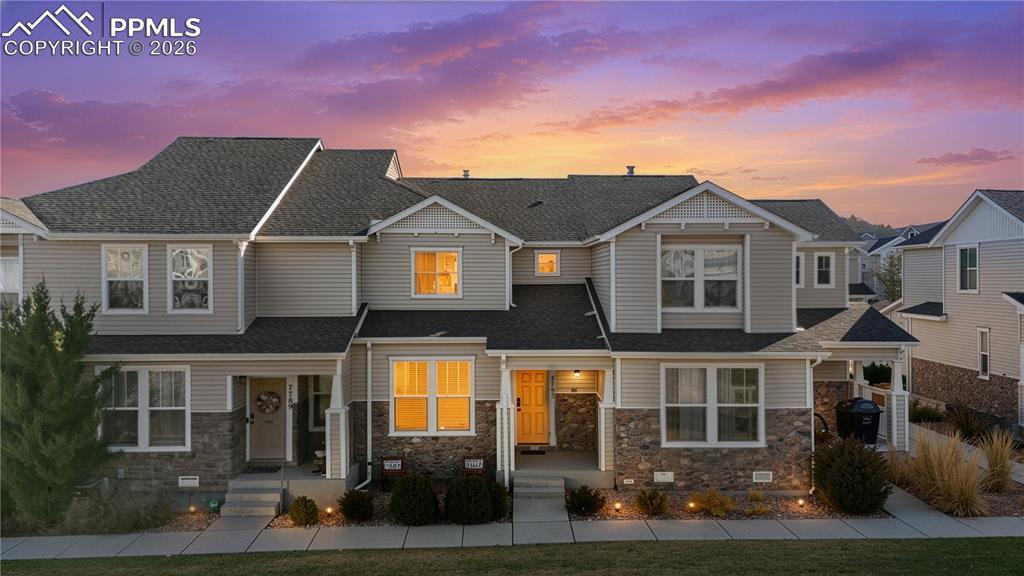 a front view of a house with yard