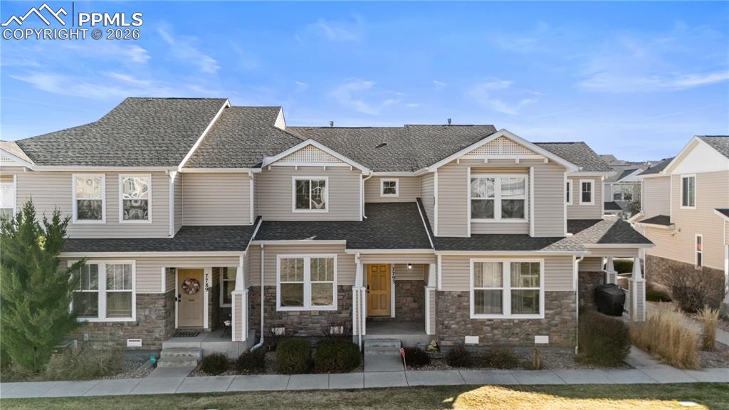 7795 Sandy Springs Point Fountain, CO 80817 - Photo 23 of 36 a front view of a residential houses with yard