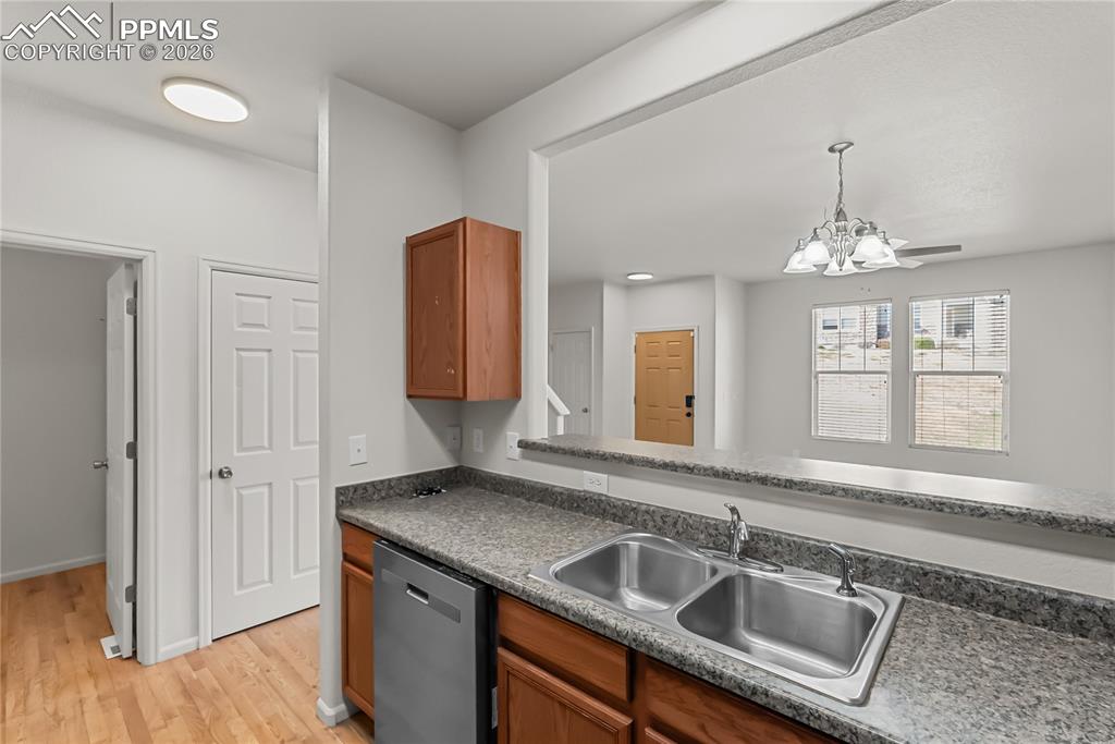 7795 Sandy Springs Point Fountain, CO 80817 - Photo 10 of 36 a kitchen with a sink and a window