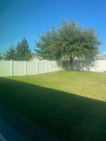 a kitchen with stainless steel appliances granite countertop a sink and refrigerator