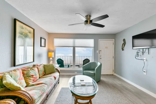 a living room with furniture and a large window