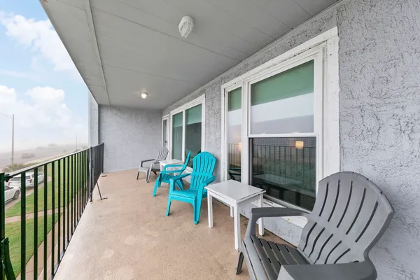 a view of a porch with furniture