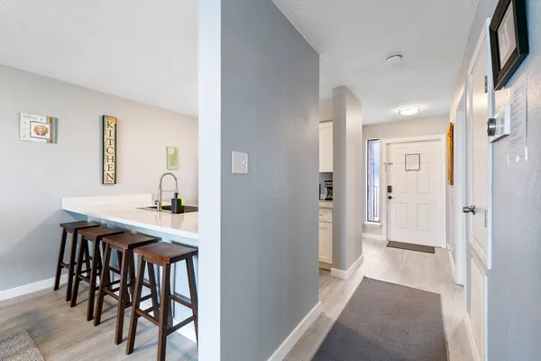 a view of a room that has a table and chairs in it