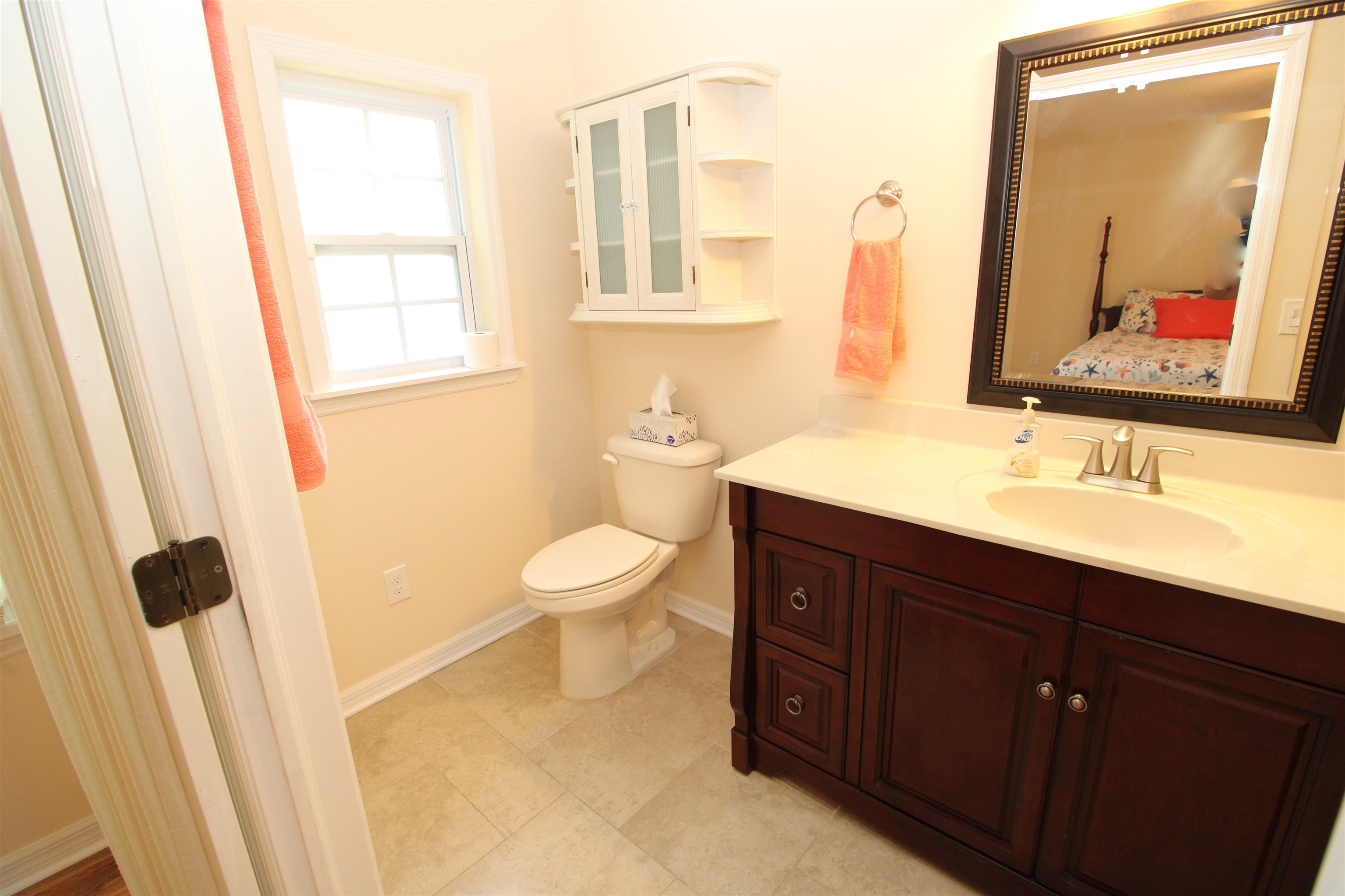 115 Porpoise Road St. Augustine, FL 32086 - Photo 16 of 41 a bathroom with a sink and a mirror