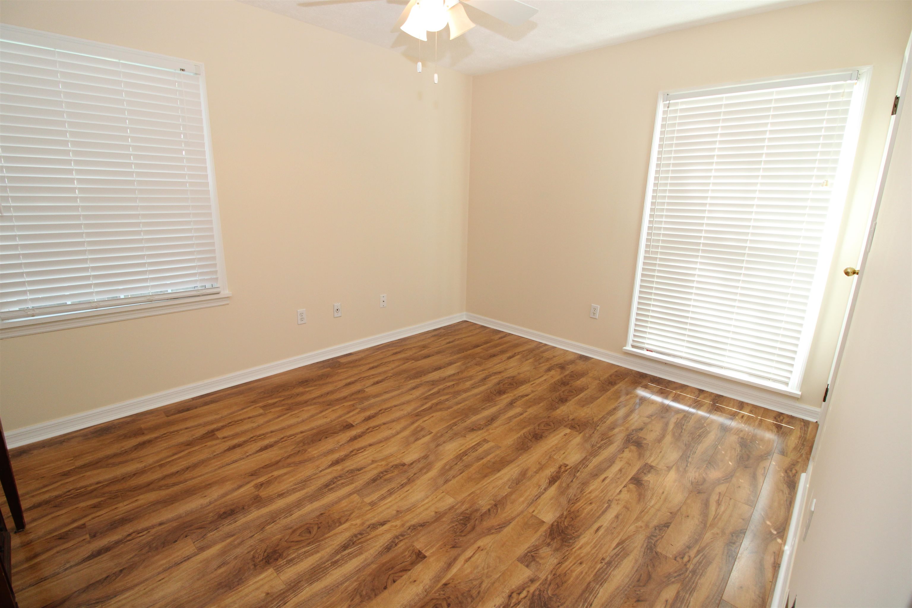 115 Porpoise Road St. Augustine, FL 32086 - Photo 18 of 41 a view of an empty room with wooden floor and a window
