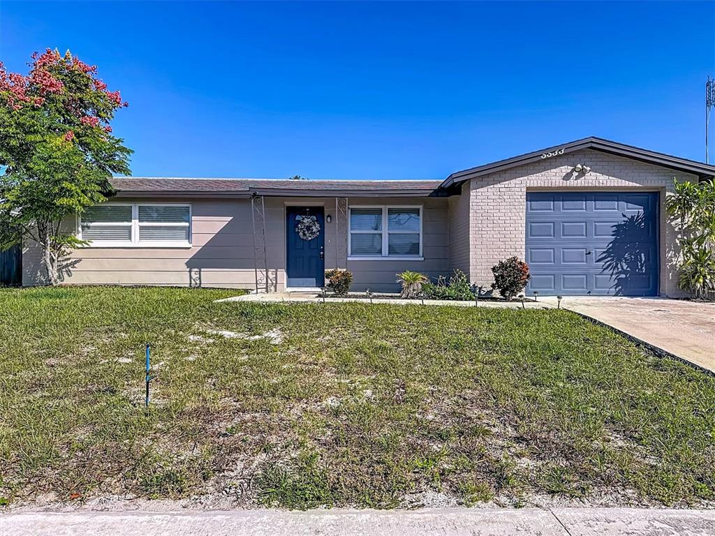 a view of a house with a yard