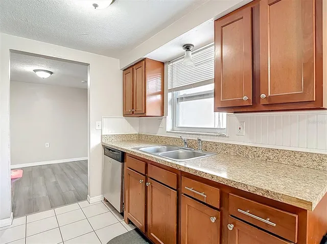 a bedroom with a bed and flat screen tv