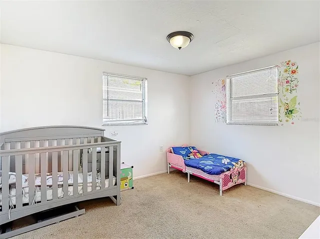 a view of a room with cabinet and mirror