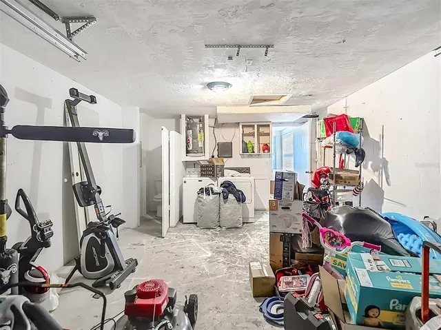 a view of a backyard with table and chairs and wooden fence