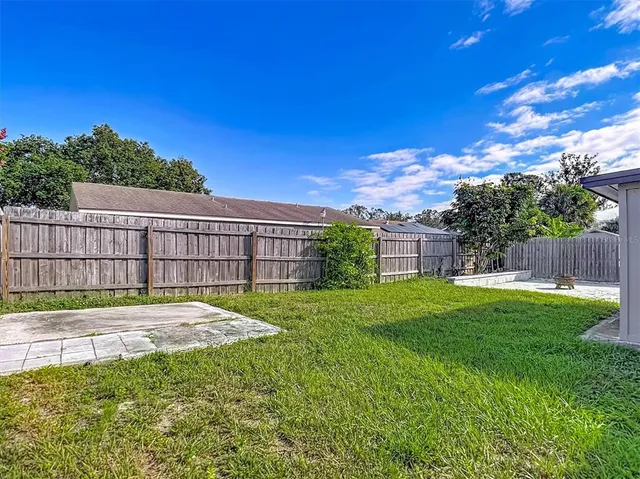 a aerial view of a house with table and chairs