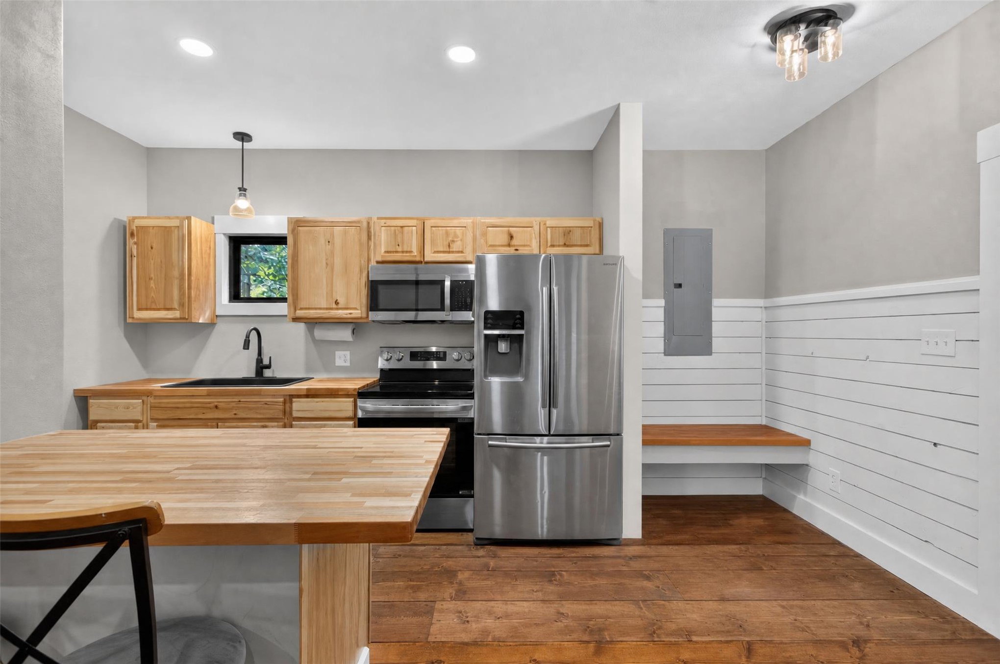 13063 East 403 Road Spavinaw, OK 74366 - Photo 6 of 25 Kitchen featuring wood-finish flooring, natural wood cabinetry, stainless steel appliances, and butcher block countertops