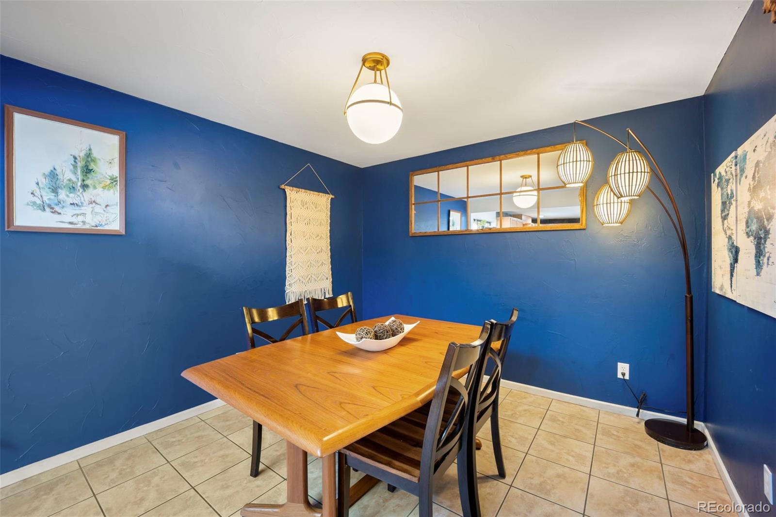 2605 Reed Court Wheat Ridge, CO 80033 - Photo 15 of 49 a dining room with a table and chairs