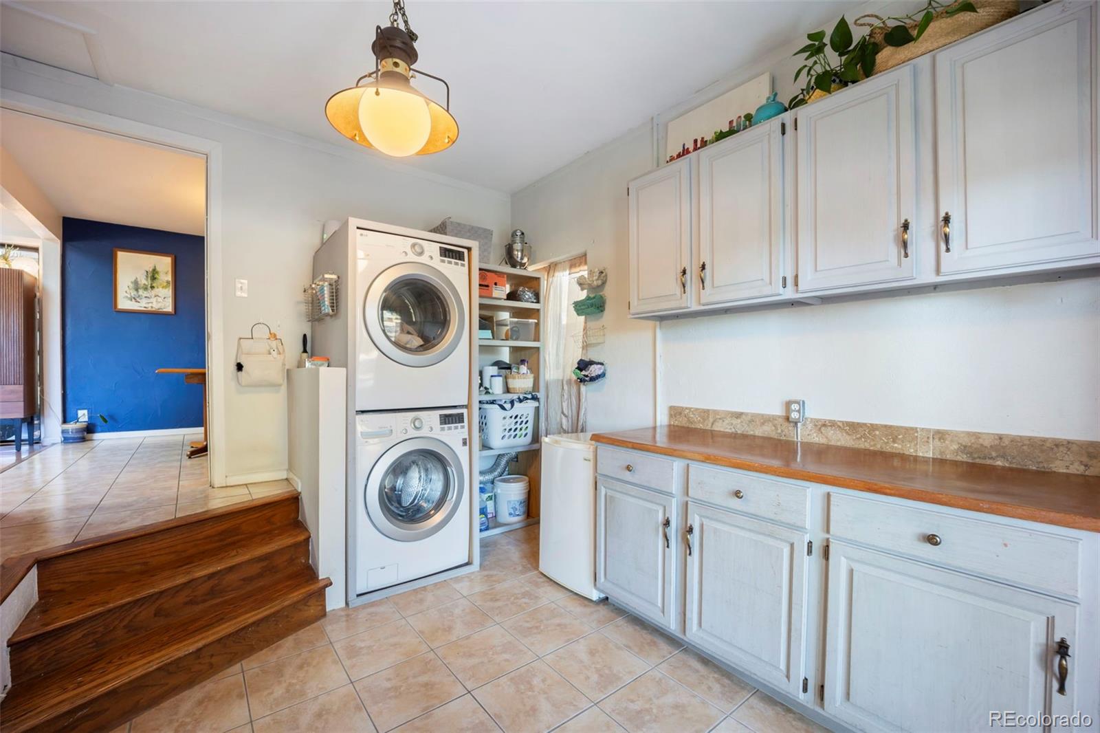 2605 Reed Court Wheat Ridge, CO 80033 - Photo 18 of 49 a utility room with sink dryer and washer