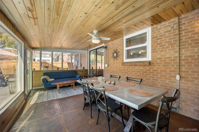 a patio with a patio table and chairs