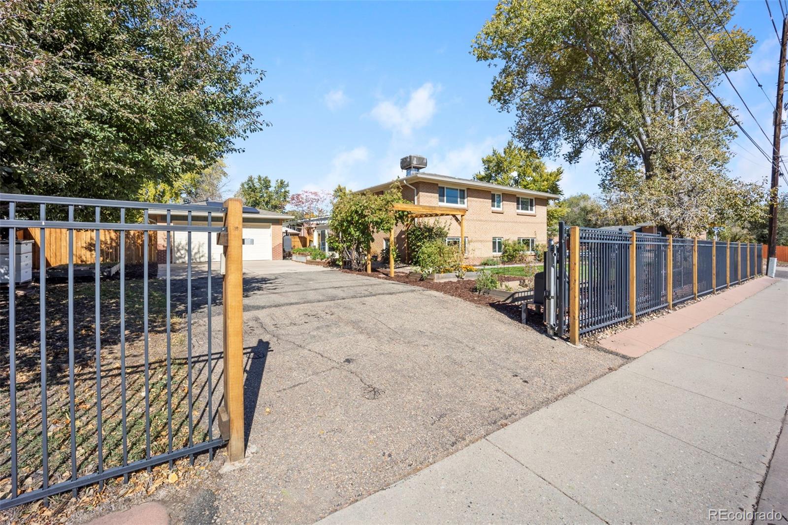 2605 Reed Court Wheat Ridge, CO 80033 - Photo 43 of 49 a view of a street with a large trees