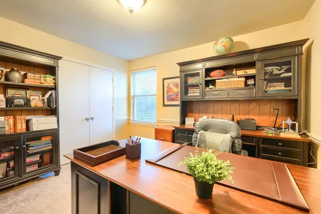 a bathroom with a sink vanity mirror and toilet