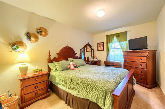 a bedroom with a bed and window