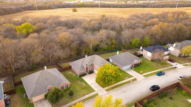 aerial view of a house with a ocean view