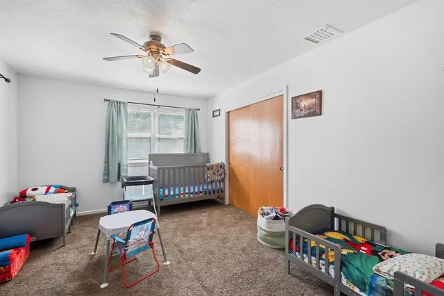 a bedroom with furniture and a window