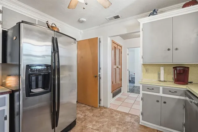 a kitchen with stainless steel appliances a refrigerator and a sink
