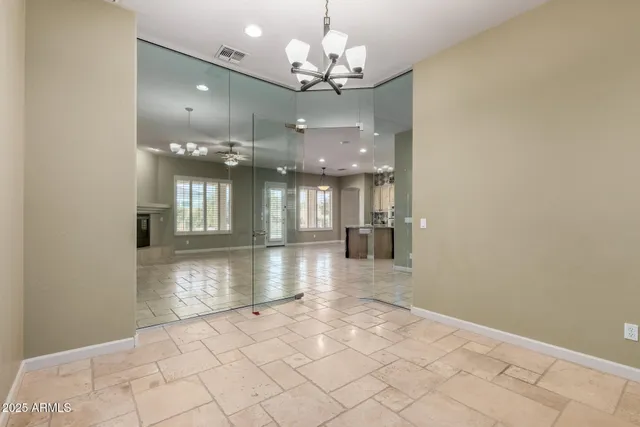 a bathroom with a toilet a sink and a mirror