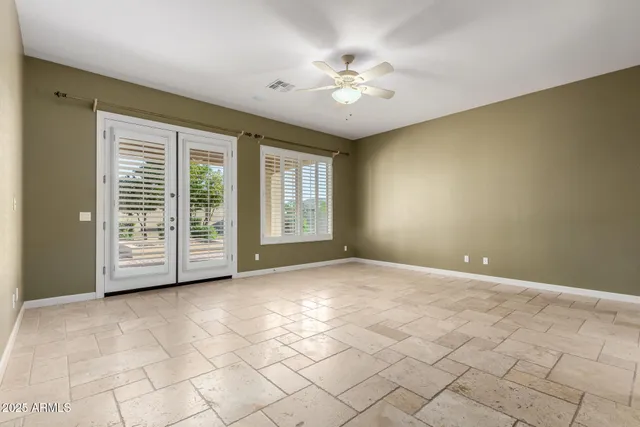 a spacious bathroom with a tub a double vanity sink a mirror and a shower