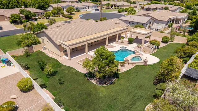 an aerial view of multiple houses with yard