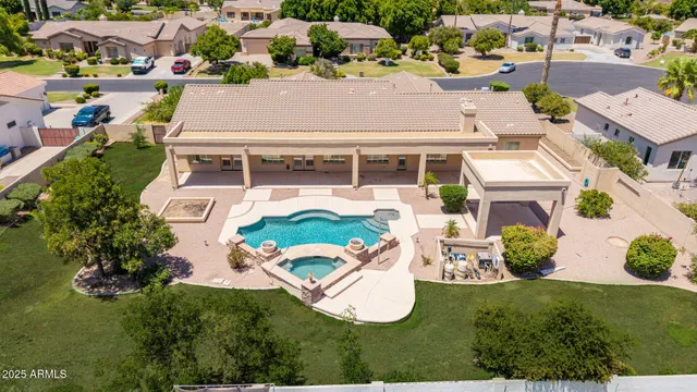 an aerial view of residential houses with outdoor space