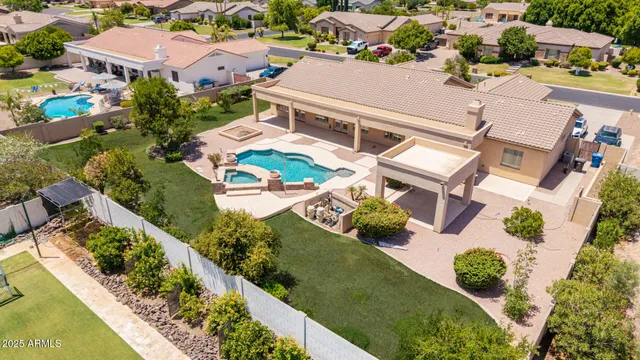 an aerial view of residential houses with outdoor space