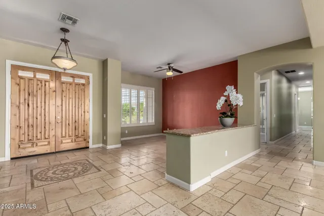 a view of an empty room with windows