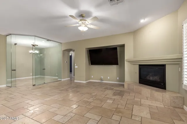 a kitchen with kitchen island granite countertop a stove refrigerator and cabinets