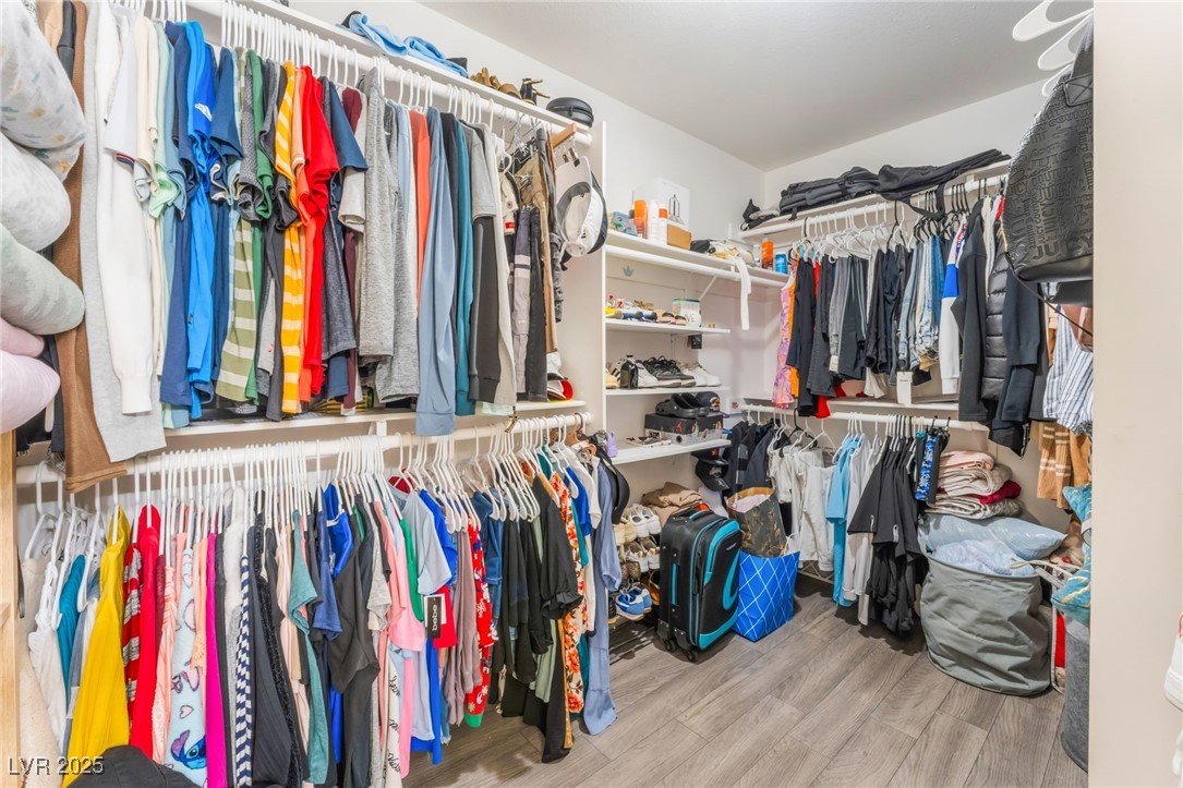 4656 East Desert Inn Road Las Vegas, NV 89121 - Photo 79 of 98 4652 E DI Spacious closet with wood finished floors
