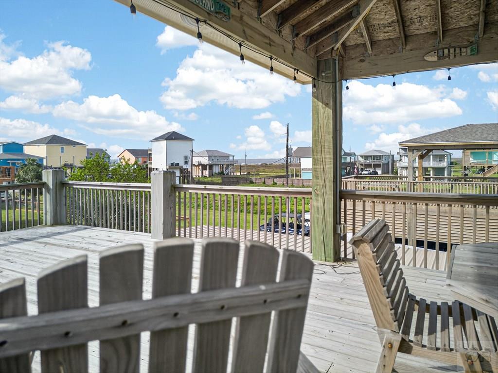 1739 Pompano Lane Crystal Beach, TX 77650 - Photo 11 of 20 a view of a balcony with wooden floor
