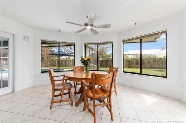 a dining room with furniture and window