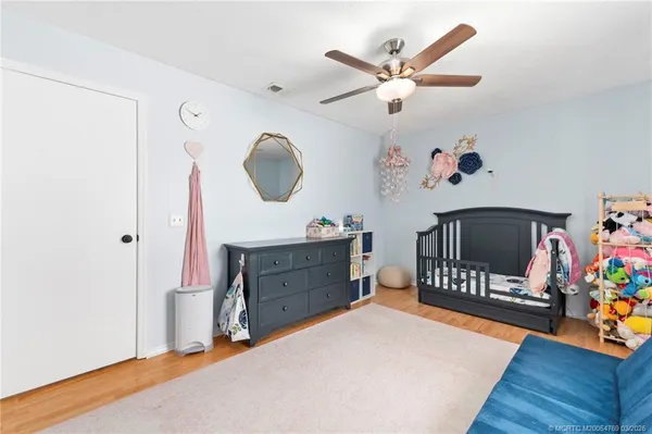 a bedroom with a bed and a dresser in it