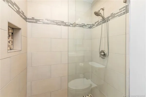 a bathroom with a shower and a toilet