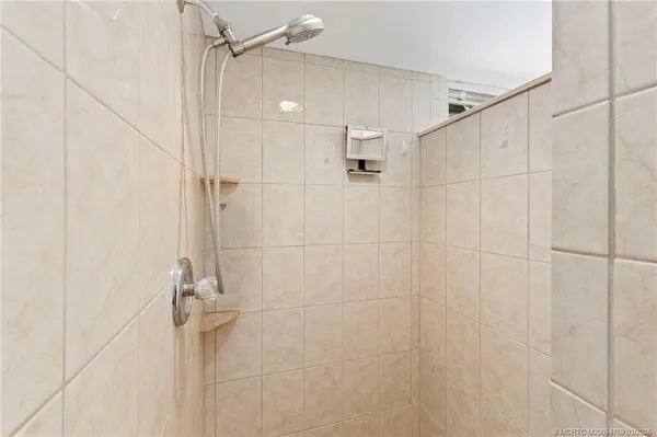 a bathroom with a shower and a shower