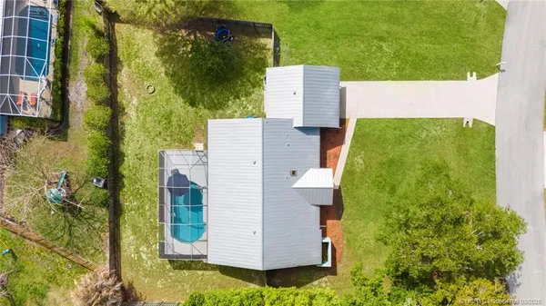an aerial view of a house with a garden