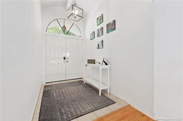 a view of an entryway with wooden floor