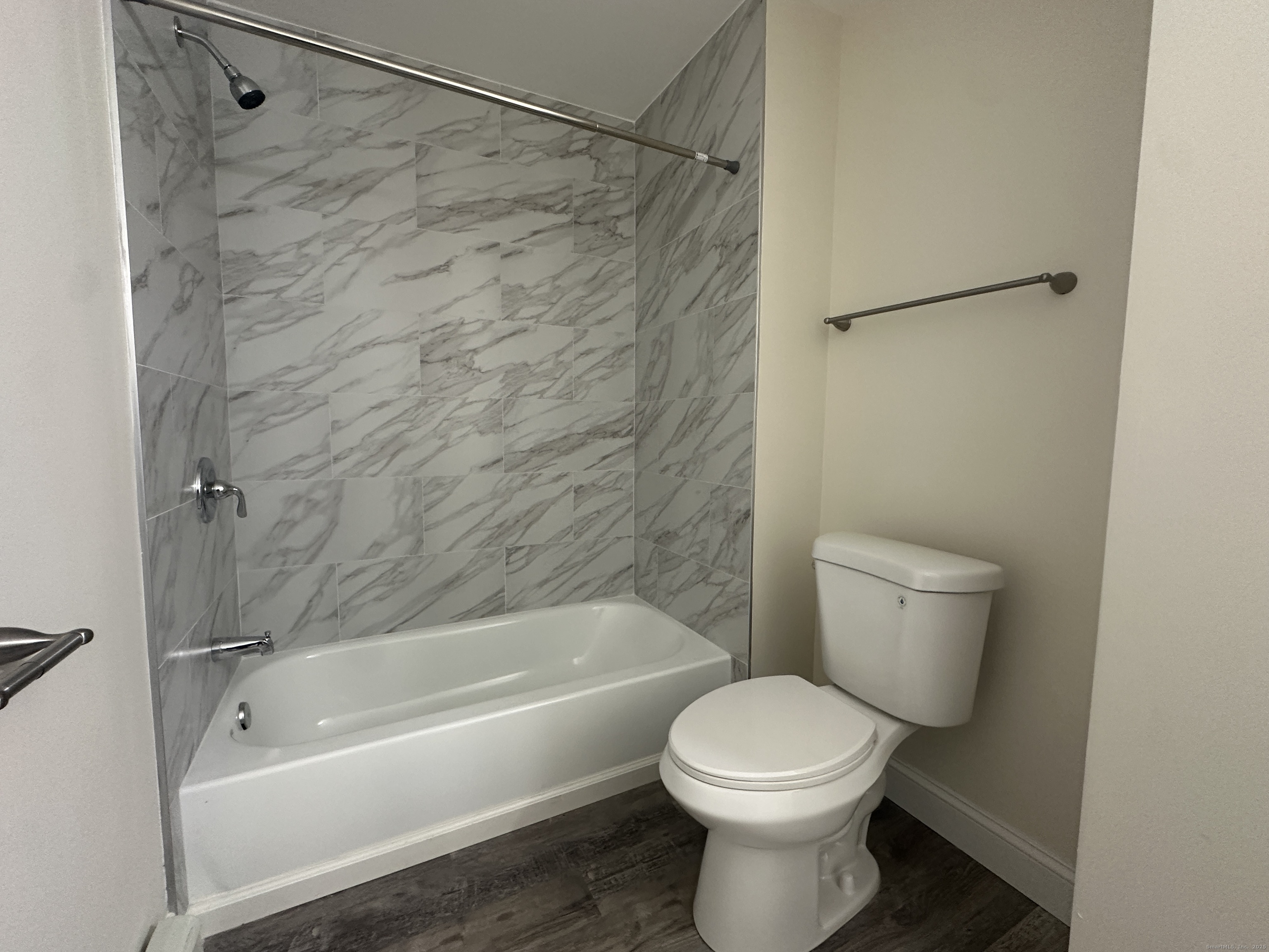 85 Twiss Street Meriden, CT 06450 - Photo 11 of 23 a bathroom with a toilet and a bathtub