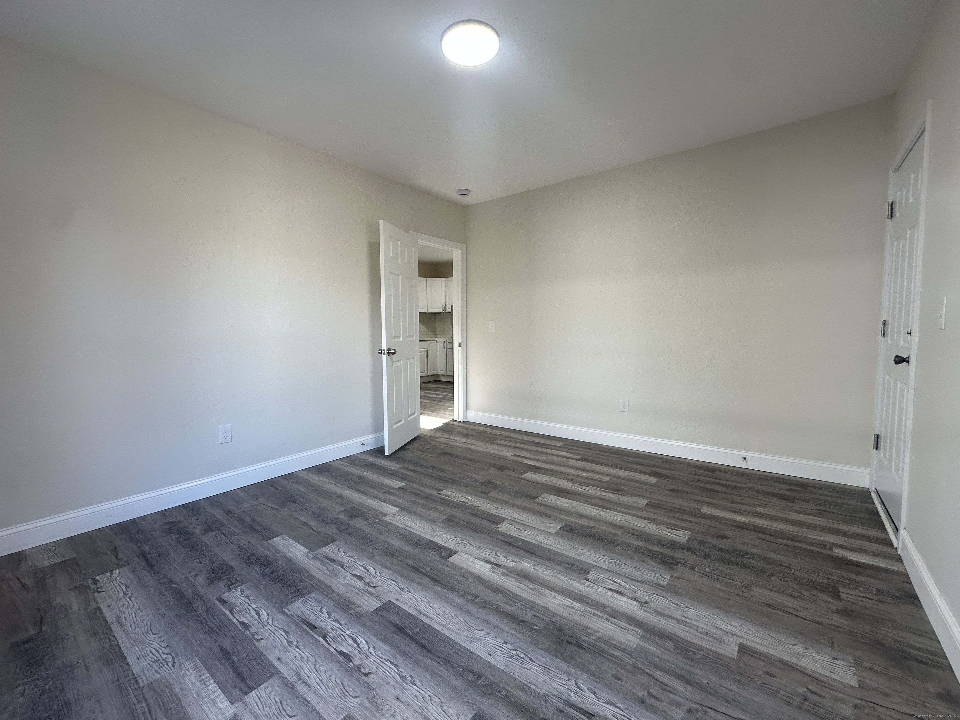 85 Twiss Street Meriden, CT 06450 - Photo 13 of 23 a view of empty room with wooden floor