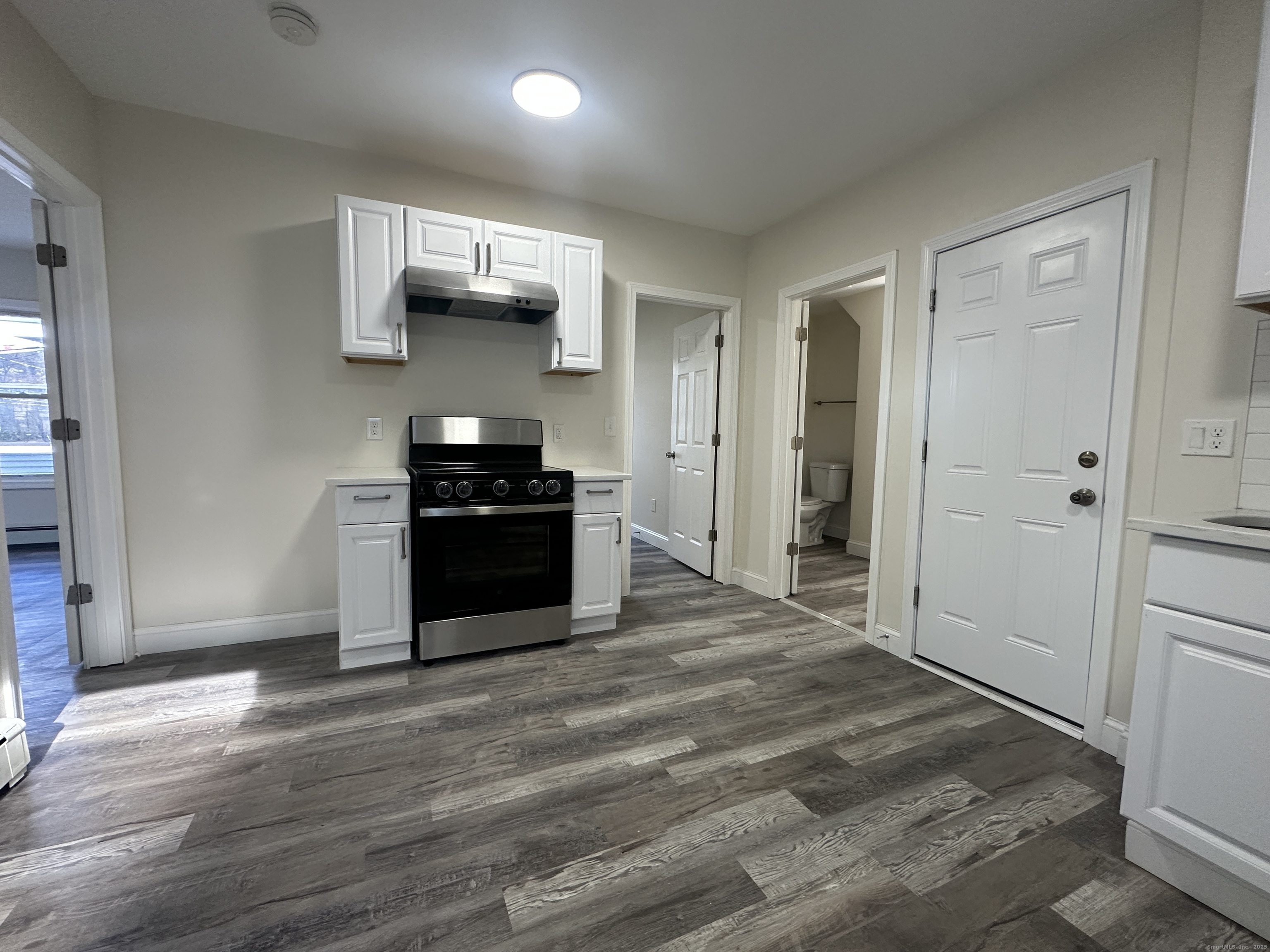 85 Twiss Street Meriden, CT 06450 - Photo 2 of 23 a kitchen with granite countertop a refrigerator and a stove