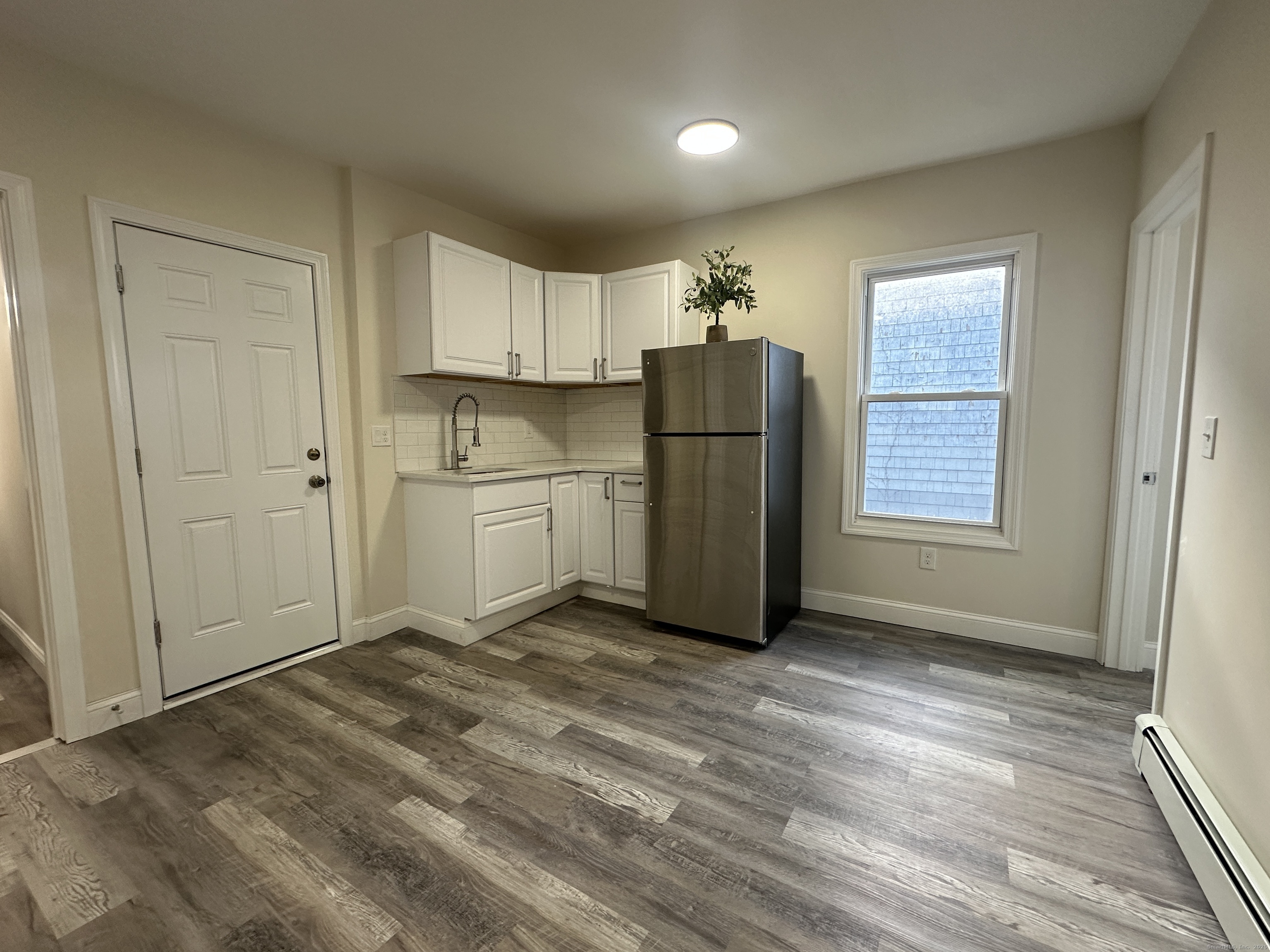 85 Twiss Street Meriden, CT 06450 - Photo 4 of 23 a view of kitchen with refrigerator and window