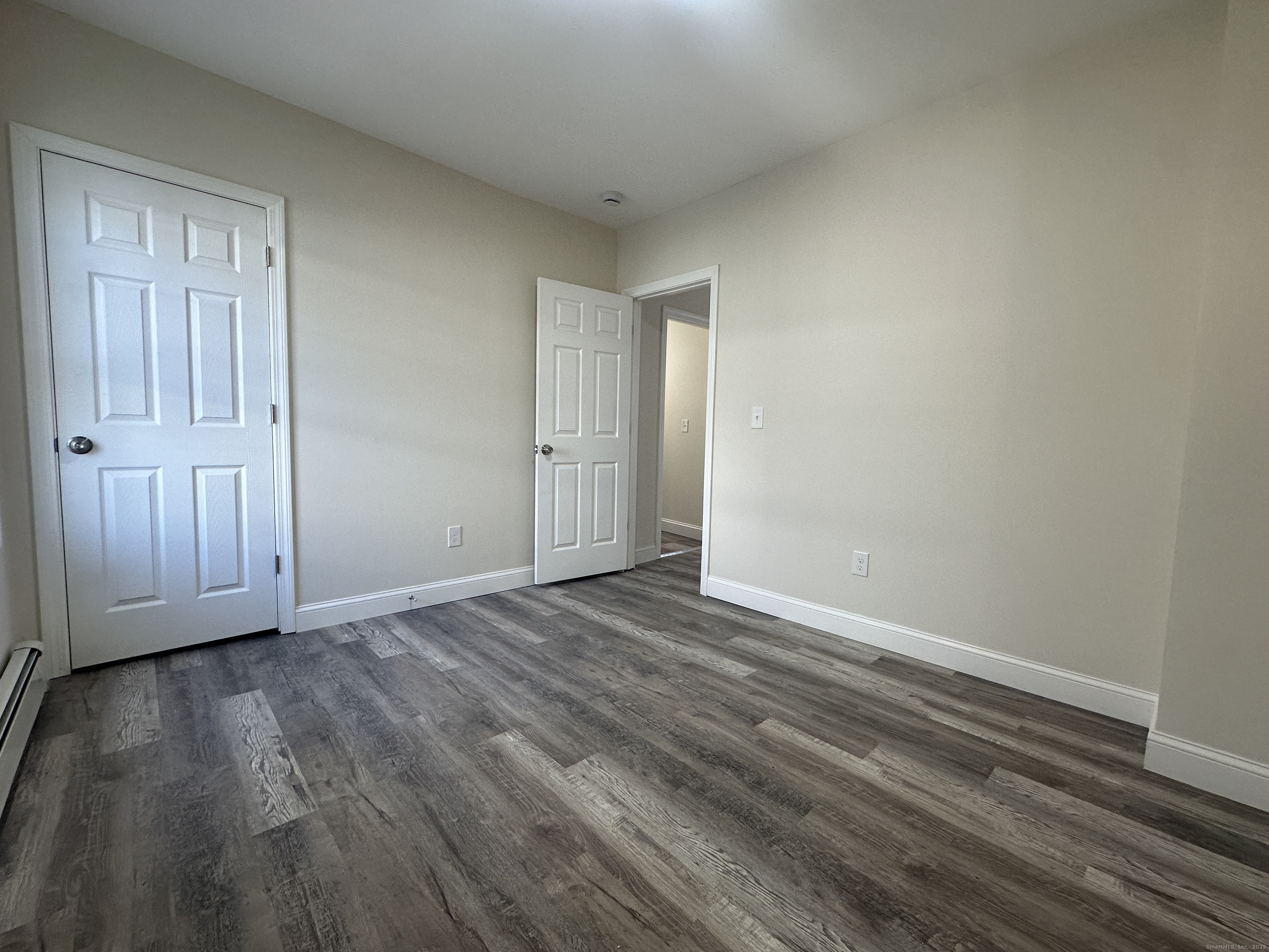 85 Twiss Street Meriden, CT 06450 - Photo 8 of 23 a view of an empty room and wooden floor