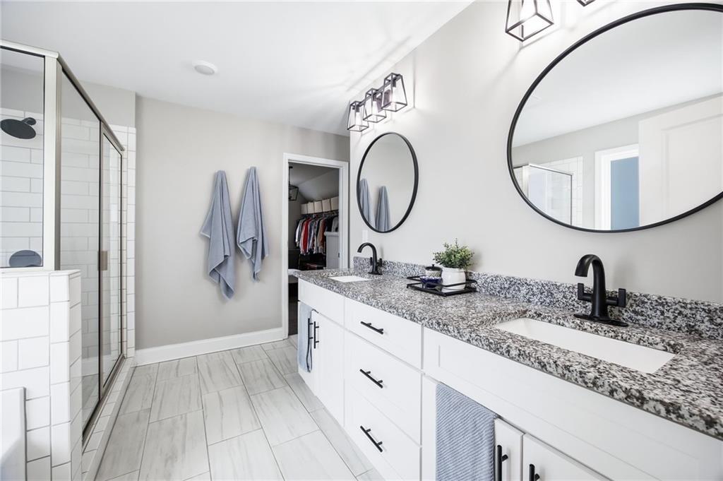 238 Observation Pointe Dallas, GA 30132 - Photo 21 of 41 a bathroom with a double vanity sink and a mirror